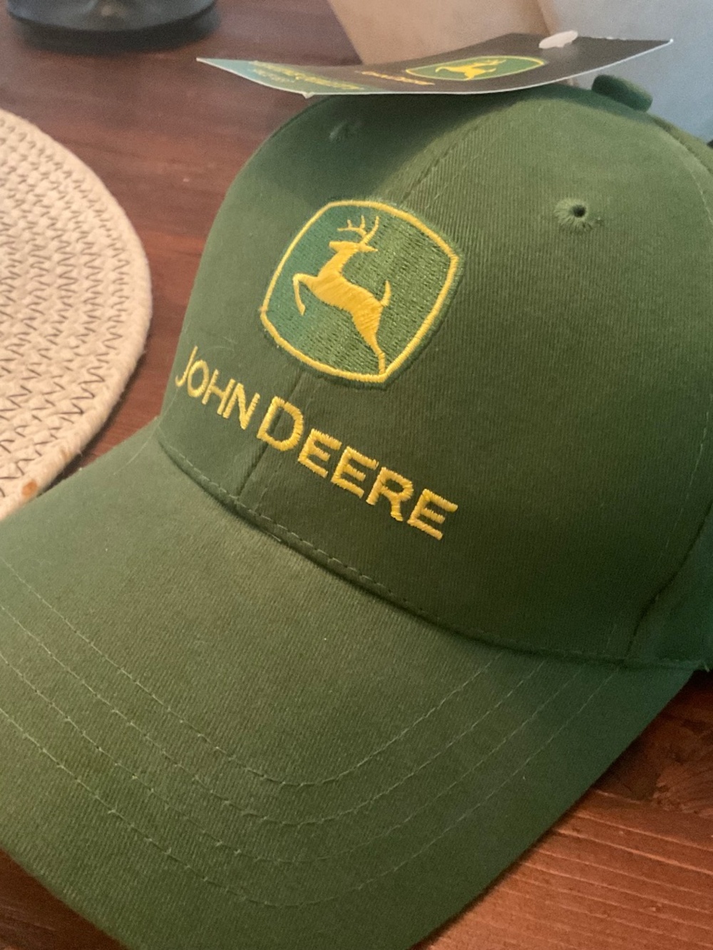 Brand new with tags John Deere Green hat with adjustable back strap, owner’s ed